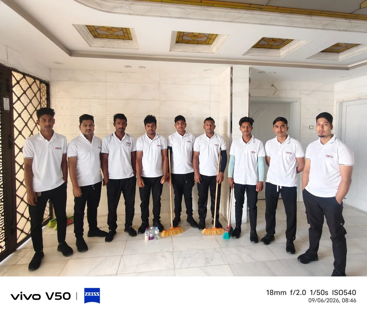 PSFM team in work uniforms with cleaning equipment